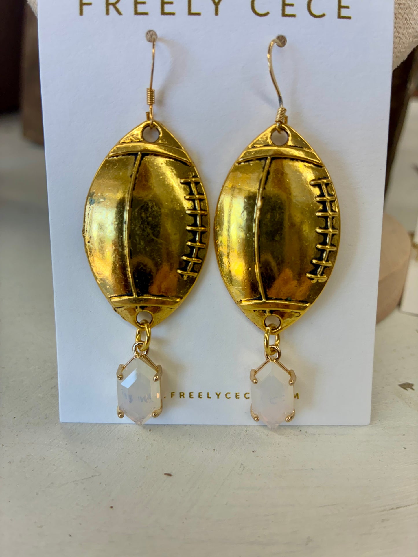 Gold Mirrored Football Earrings with White A/B Stone