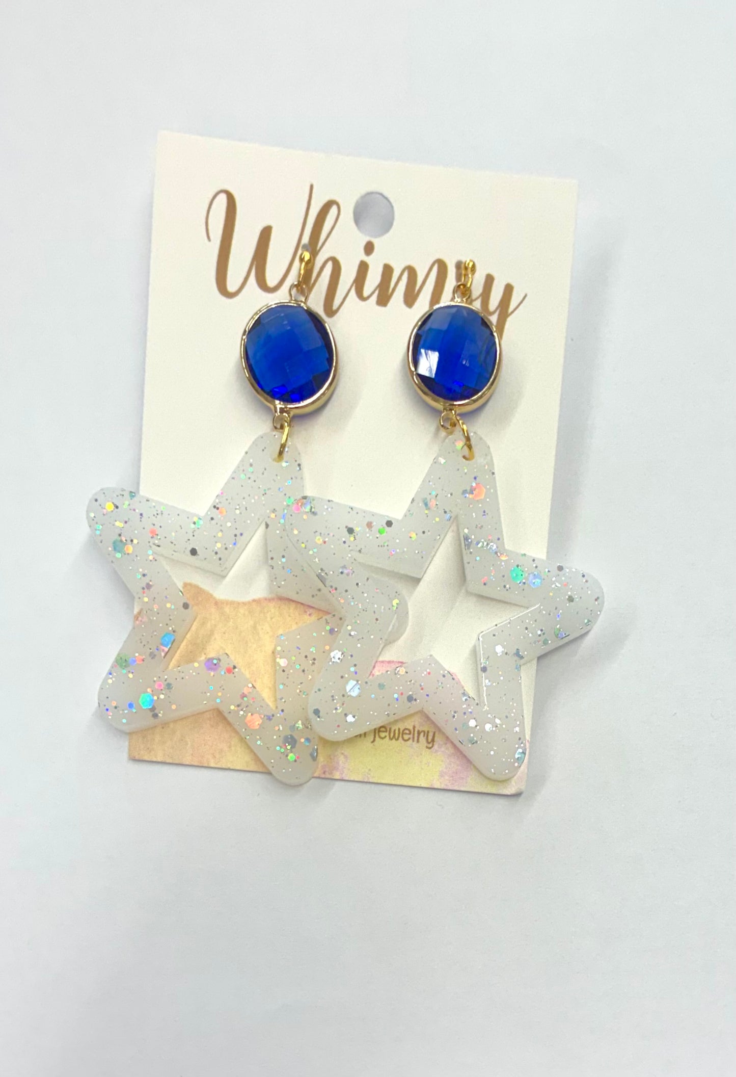 White Glitter Star Earrings with Round Blue Stone