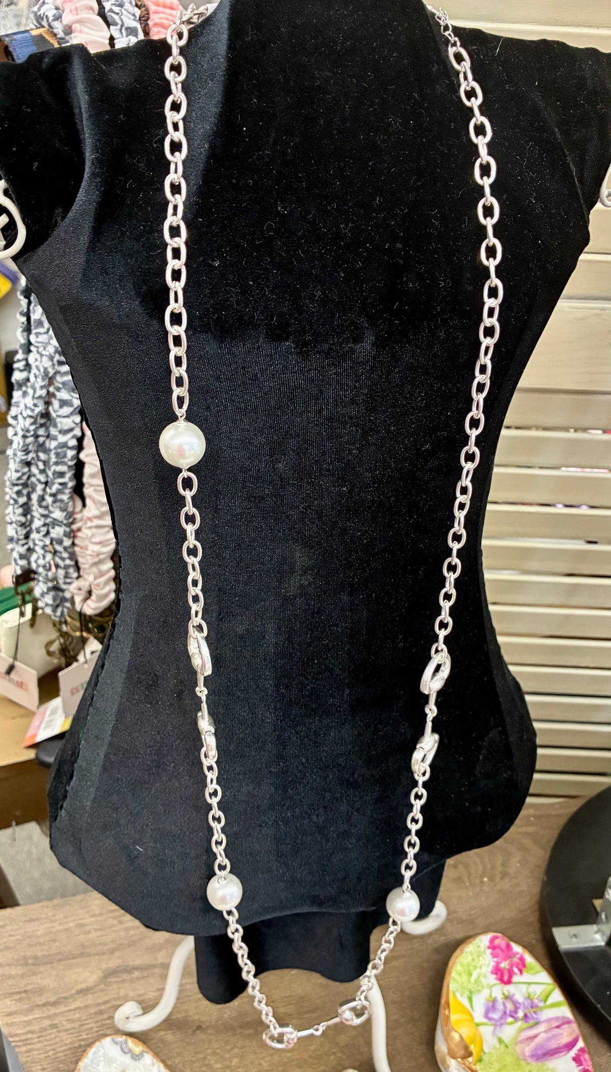 Dupe long silver-tone chain necklace featuring alternating white pearl beads and equestrian horse-bit links
