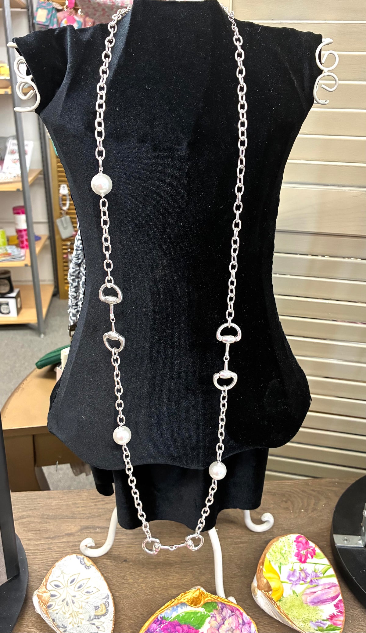 Dupe long silver-tone chain necklace featuring alternating white pearl beads and equestrian horse-bit links