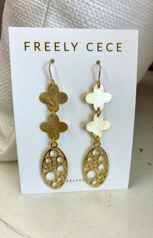 These Freely Cece drop earrings feature etched quatrefoil shapes suspending a circle-patterned oval dangle.