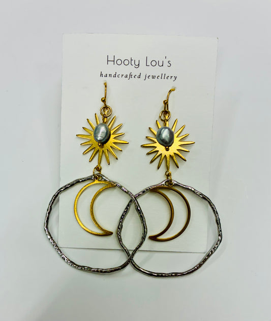 Celestial Earrings - silver-toned textured hoops and gold-toned sun and moon pendants with small gemstones.
