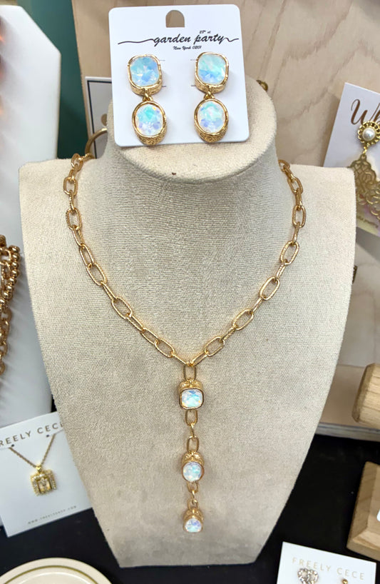 Gold-tone chunky link lariat necklace featuring iridescent opalescent stone drops with matching earrings.  Sold separately.
