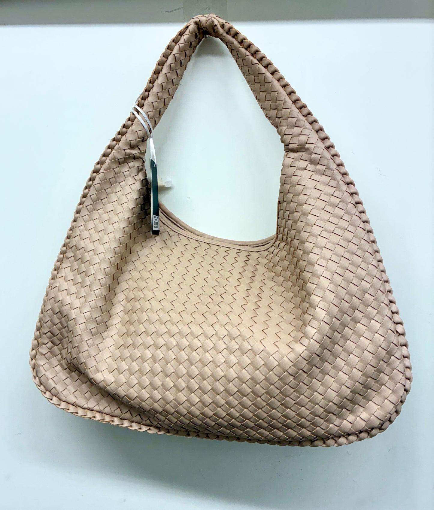 La Terre woven hobo shoulder bag featuring a braided handle and a structured yet slouchy silhouette.
