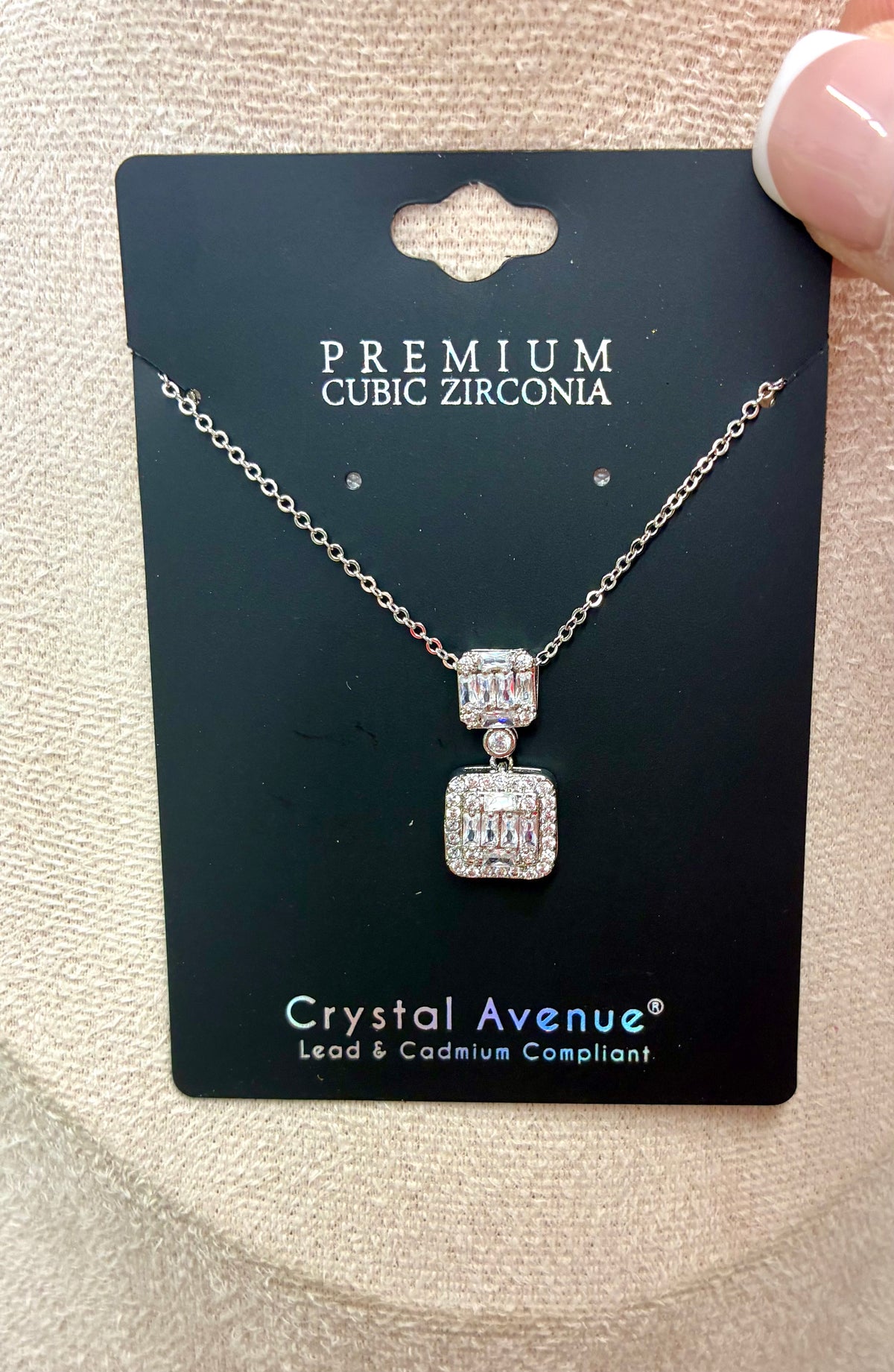 Double square cubic zirconia pendant necklace featuring a silver-tone chain and rectangular crystal clusters.