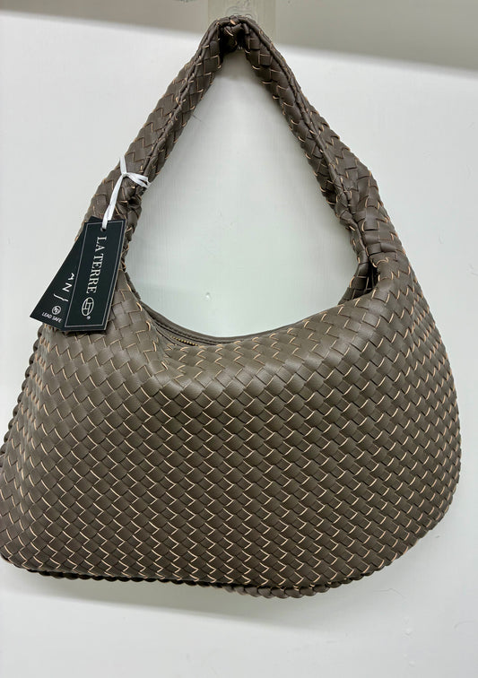 La Terre woven hobo shoulder bag featuring a braided handle and a structured yet slouchy silhouette.
