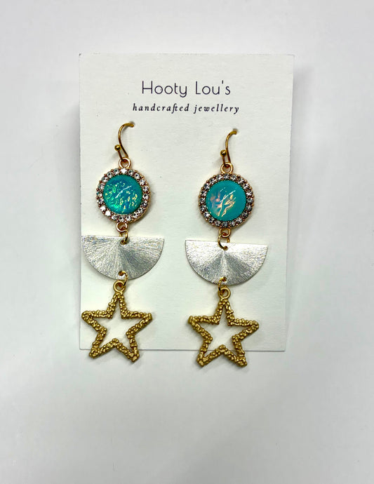 celestial-themed dangle earrings featuring an iridescent opal-like stone and a gold-colored star pendant