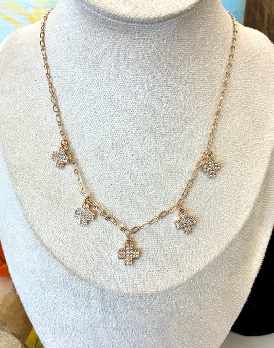 Water-resistant gold-tone necklace and matching triple-cross drop earrings featuring pavé crystal-paved cross charms.
Sold Separately 
2-available of each